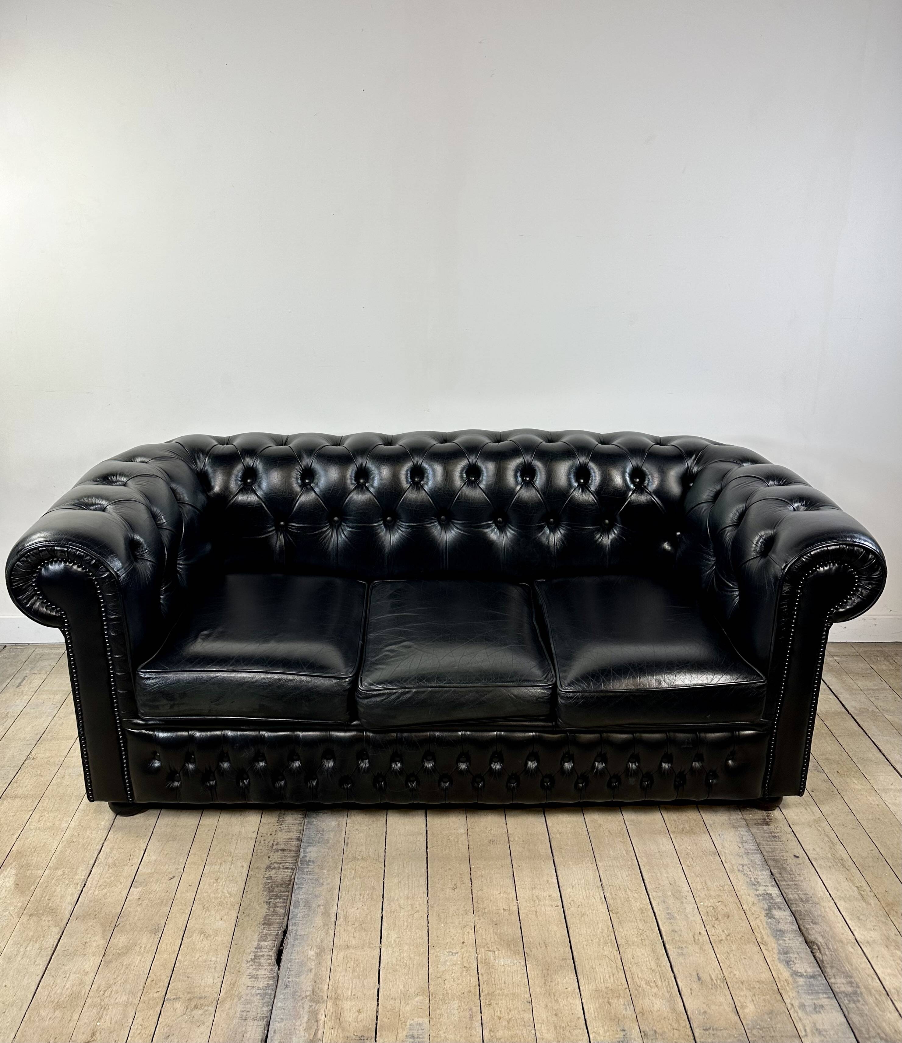 Vintage 1980 black leather Chesterfield sofa