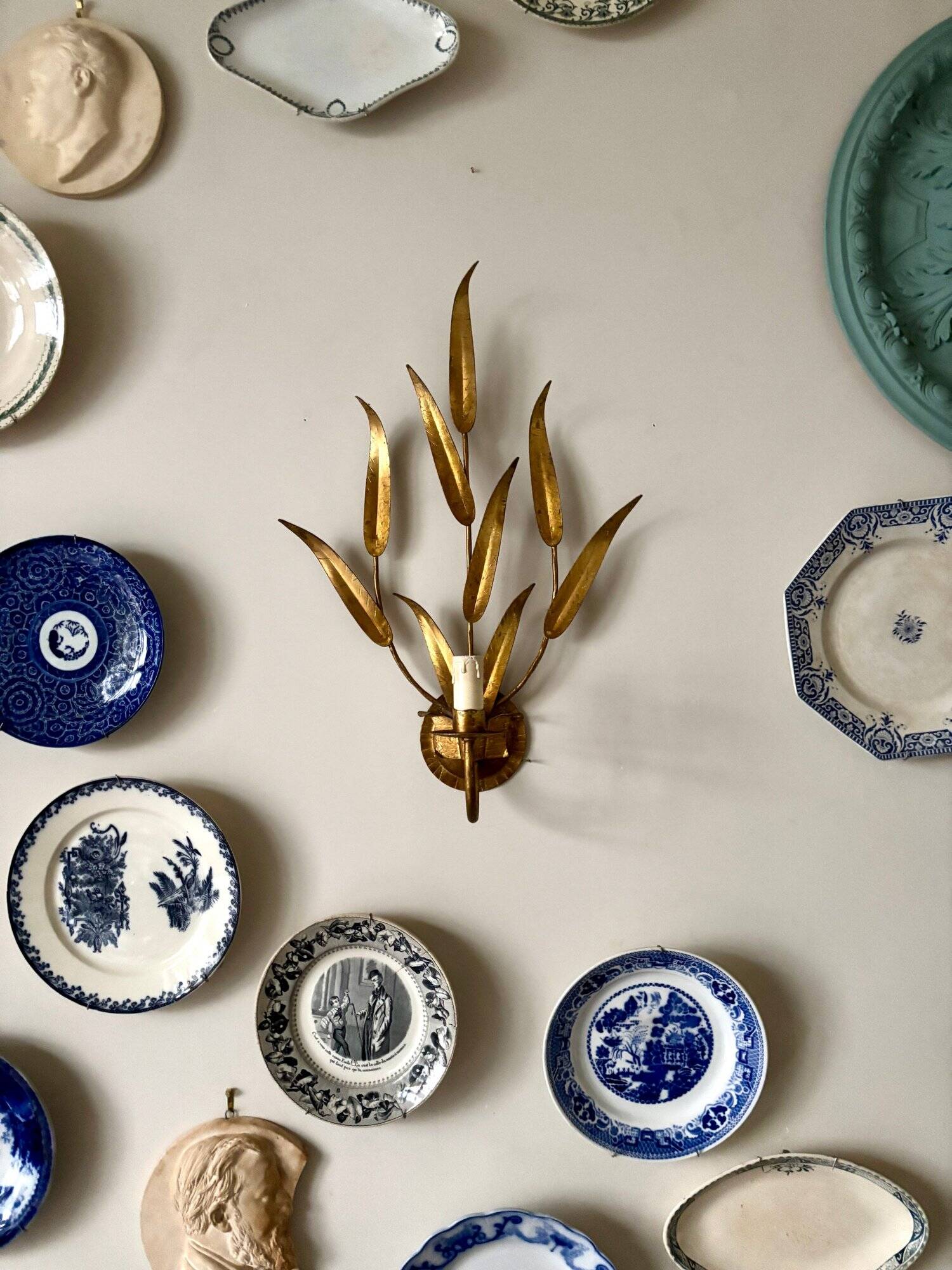 Gold metal leaf wall light