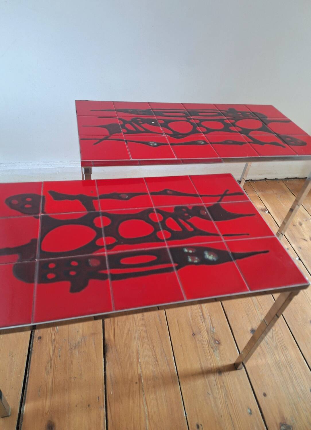 Pair of nesting coffee tables, vintage ceramic furniture.