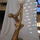 Lamp depicting a with a drape