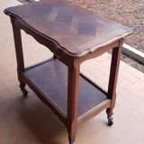 Wooden side table on casters
