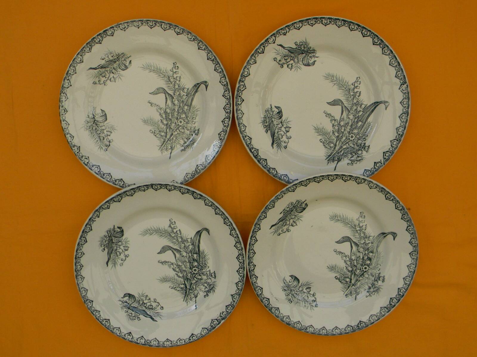 Set of 4 flat plates in saint amand earthenware. lily of the valley decor.