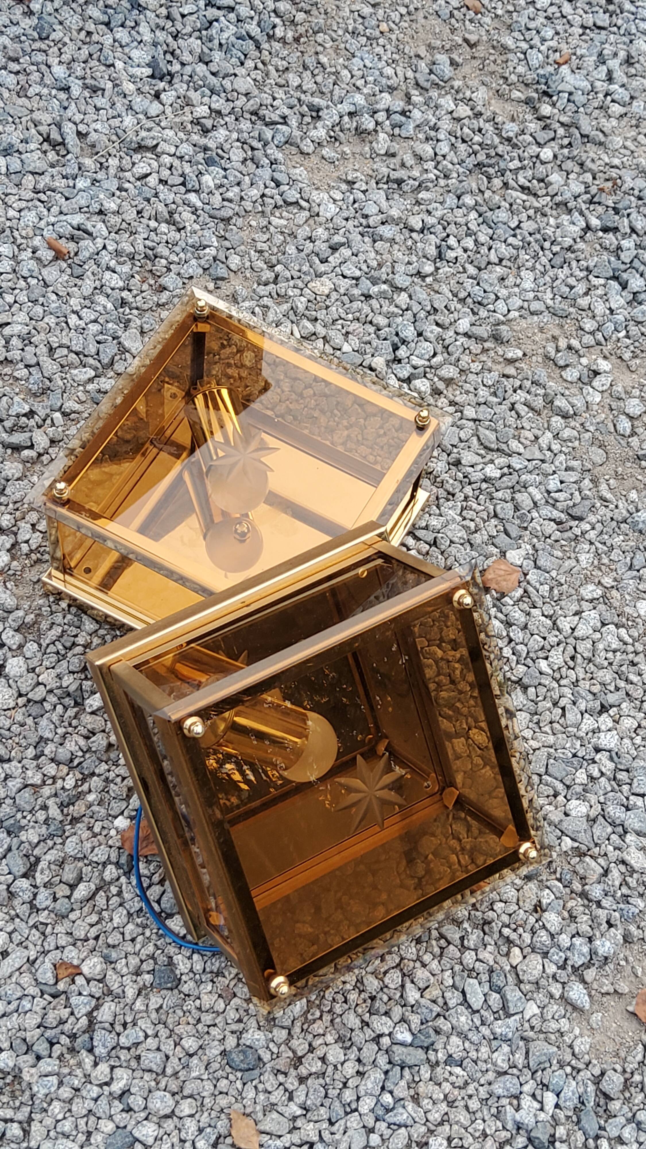 Pair of wall lamps in smoked glass and gilded metal from the 70s/80s