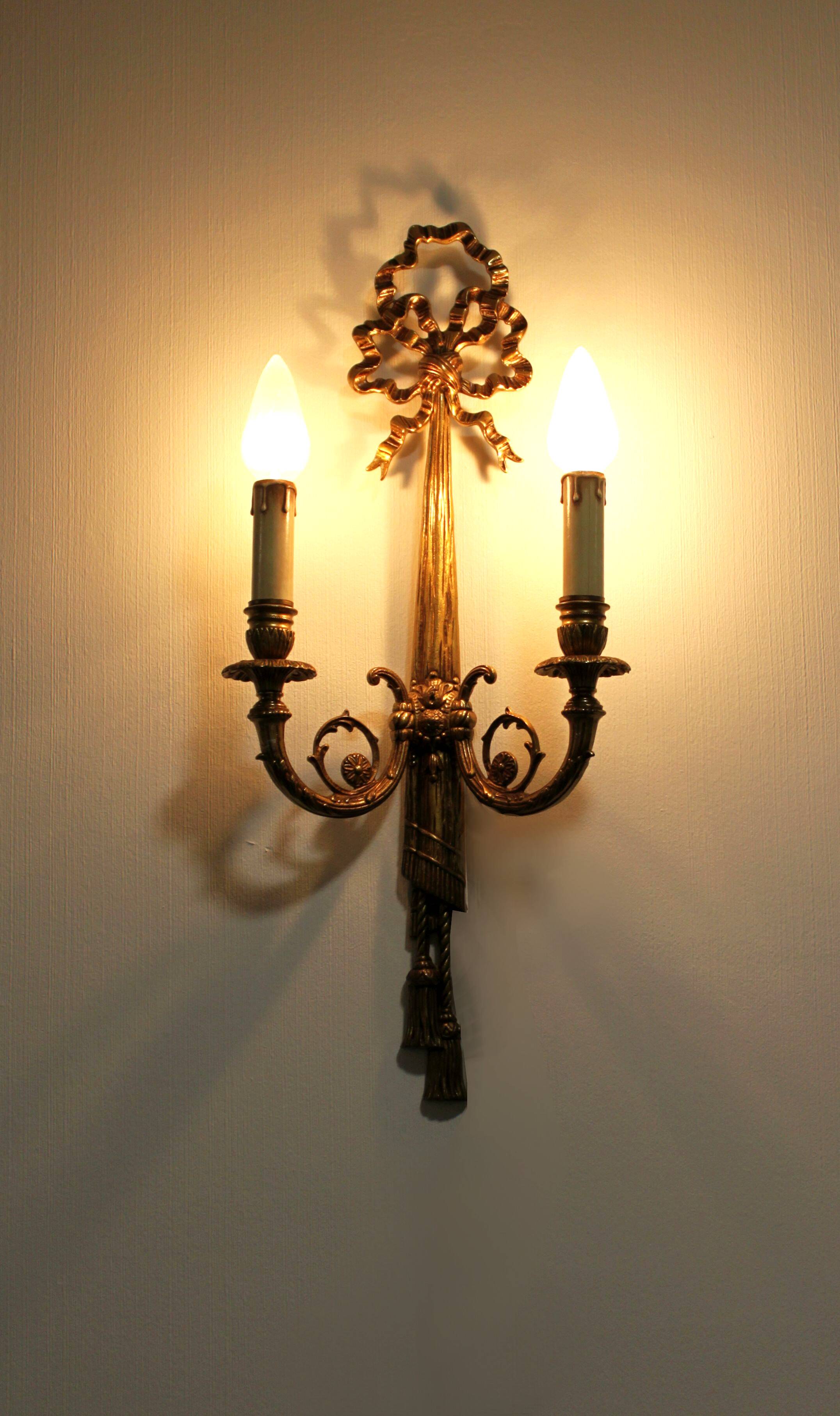 Pair of wall sconces in gilded bronze, Louis XVI style.
