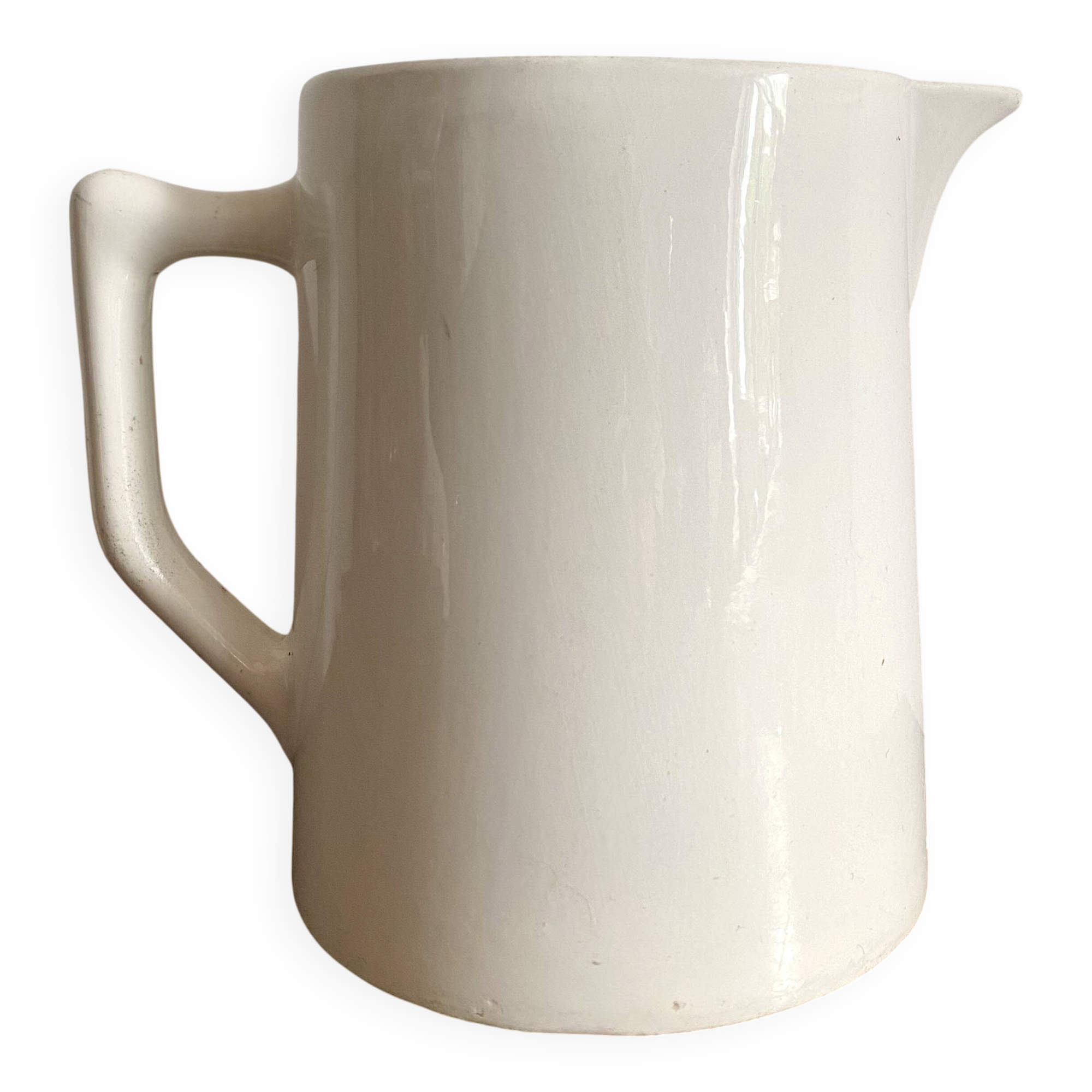 Old white earthenware jug