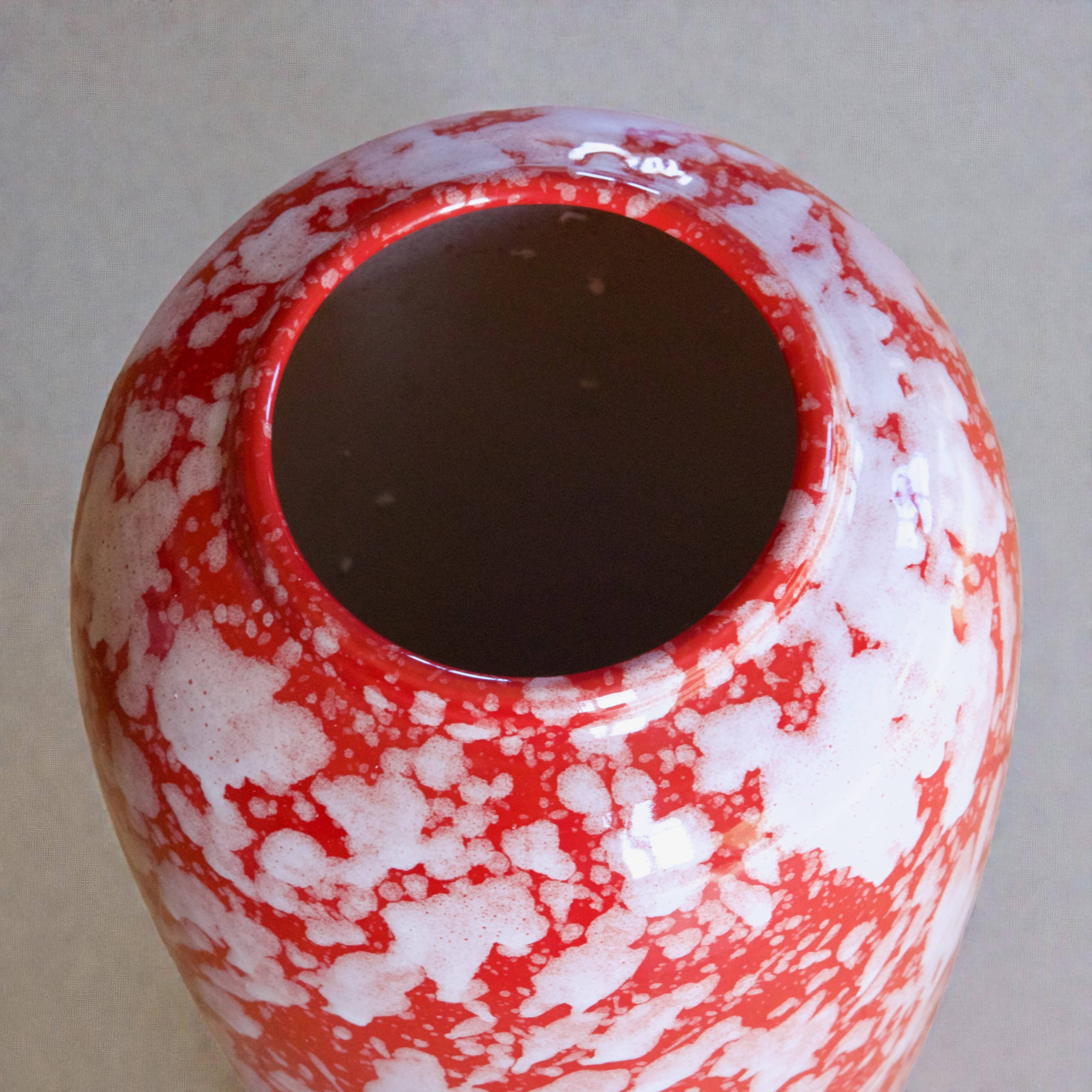 Large handcrafted vase in red speckled glazed ceramic.