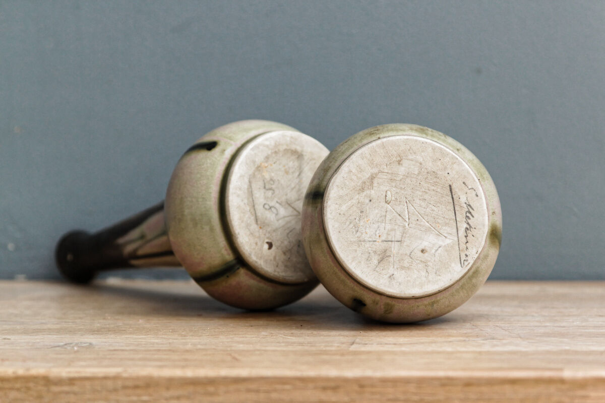 Pair of glazed sizzlings, signed