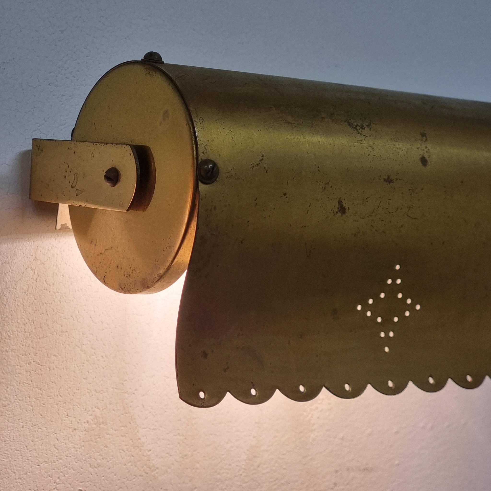 A pair of charming wall sconces/branches in brass with a star pattern, modern Scandinavian style.