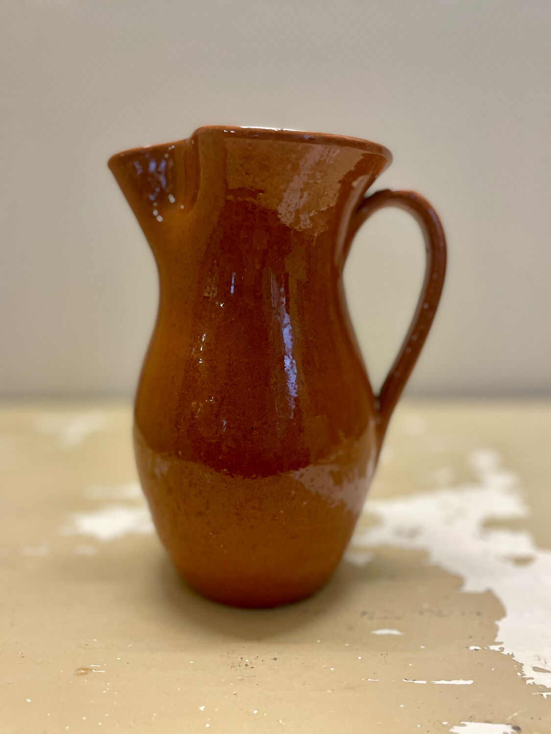Vintage glazed terracotta pitcher