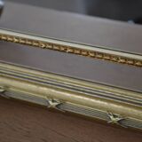 Large mirror with gilded and carved wooden glazing beads