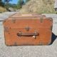 Old travel trunk made of wood and brass