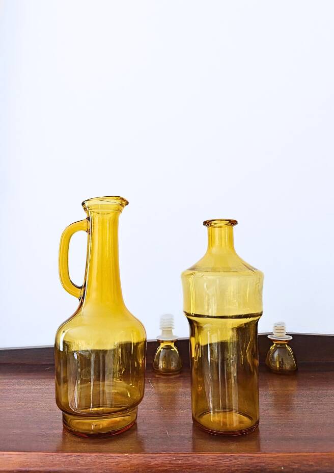 Set of two vintage amber glass carafes attributed to Lubiana.