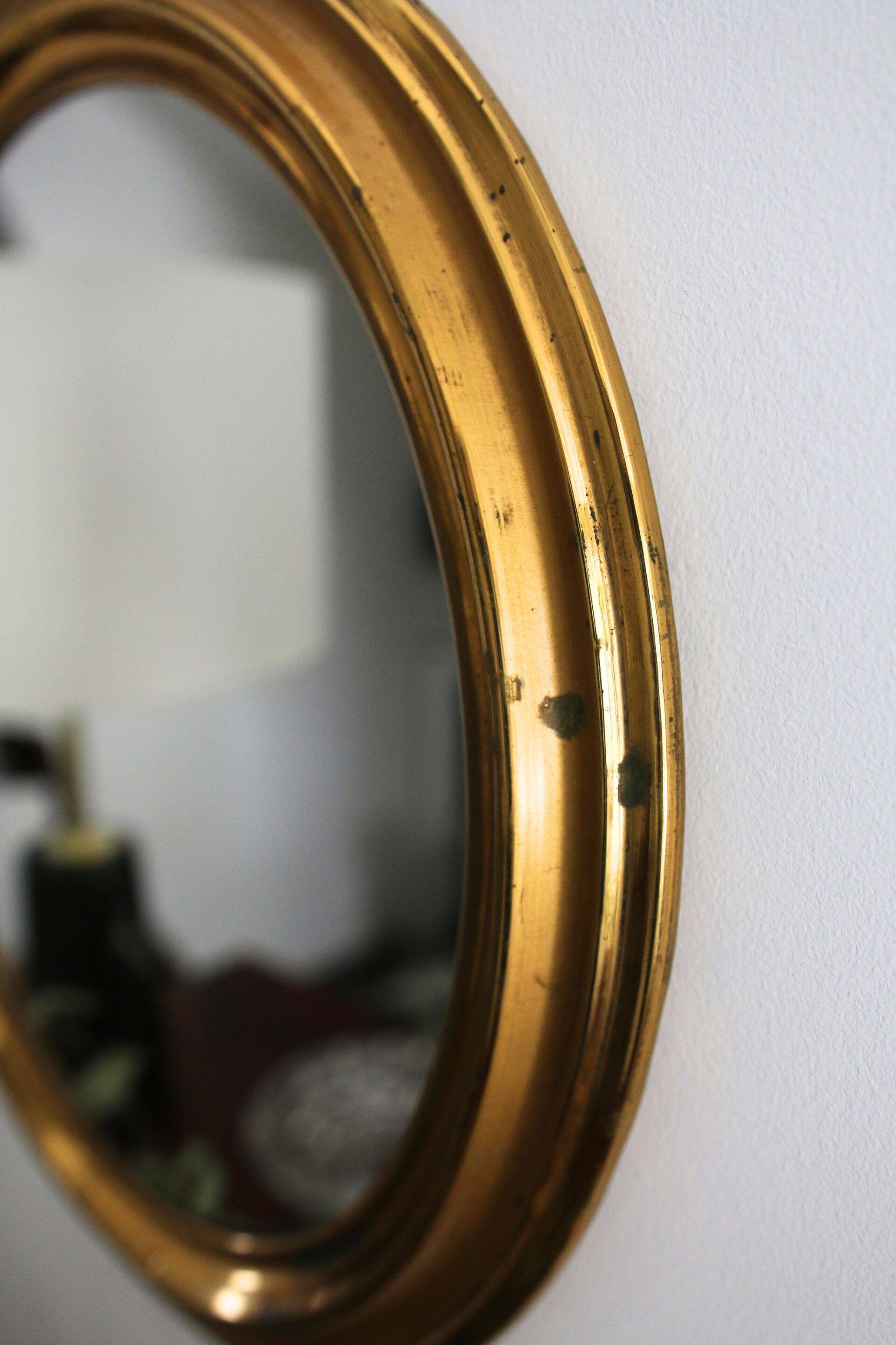 Oval brass mirror