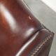 Vintage sheepskin wingback armchair with a timeless English look