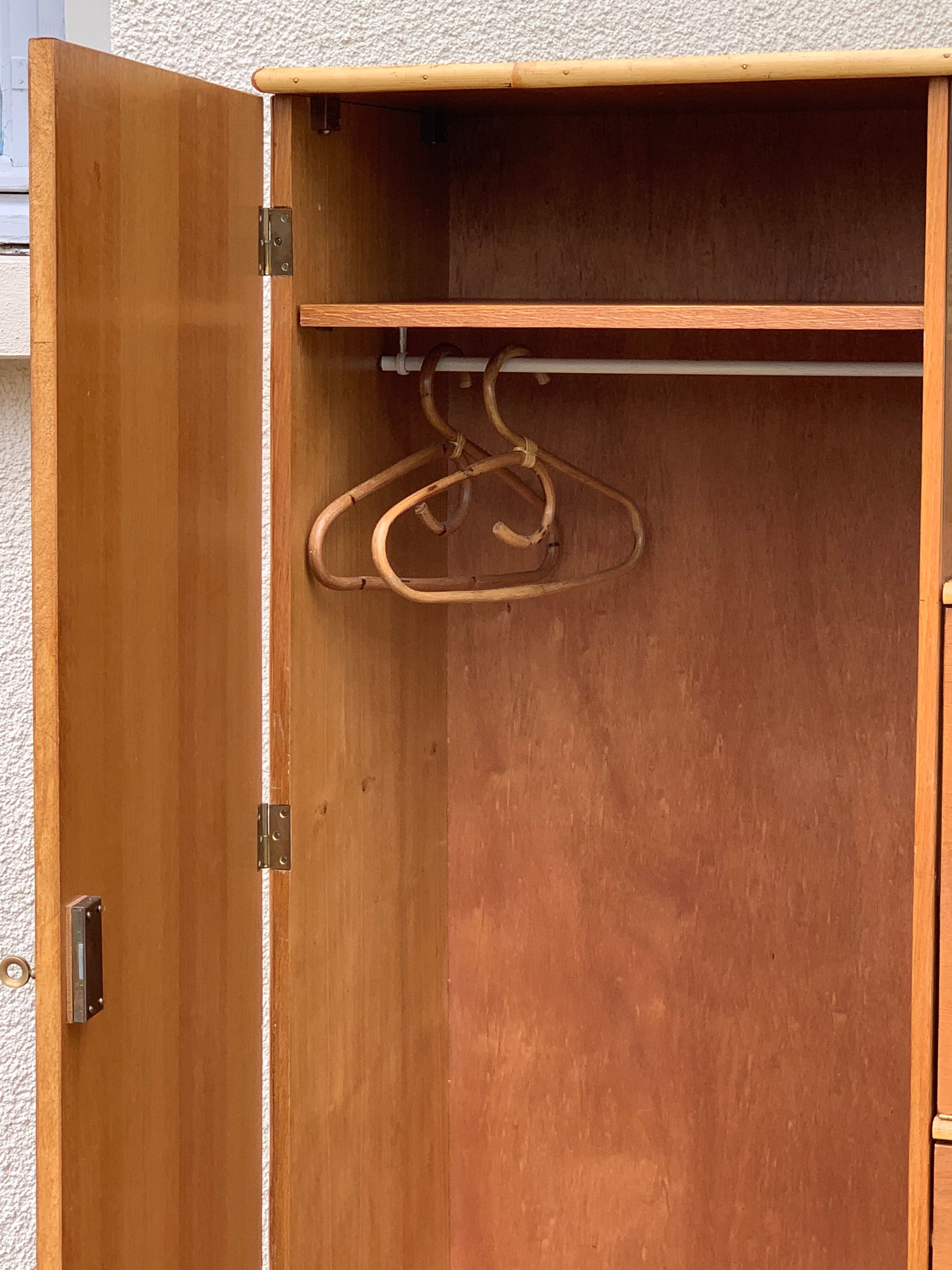 Rattan wardrobe with tapered legs from the 1960s.