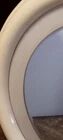 1970s mirror with integrated lighting, futuristic design, vintage wood.