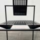 Postmodern black Quinta chair in perforated metal by Mario Botta for Alias, 1980s.