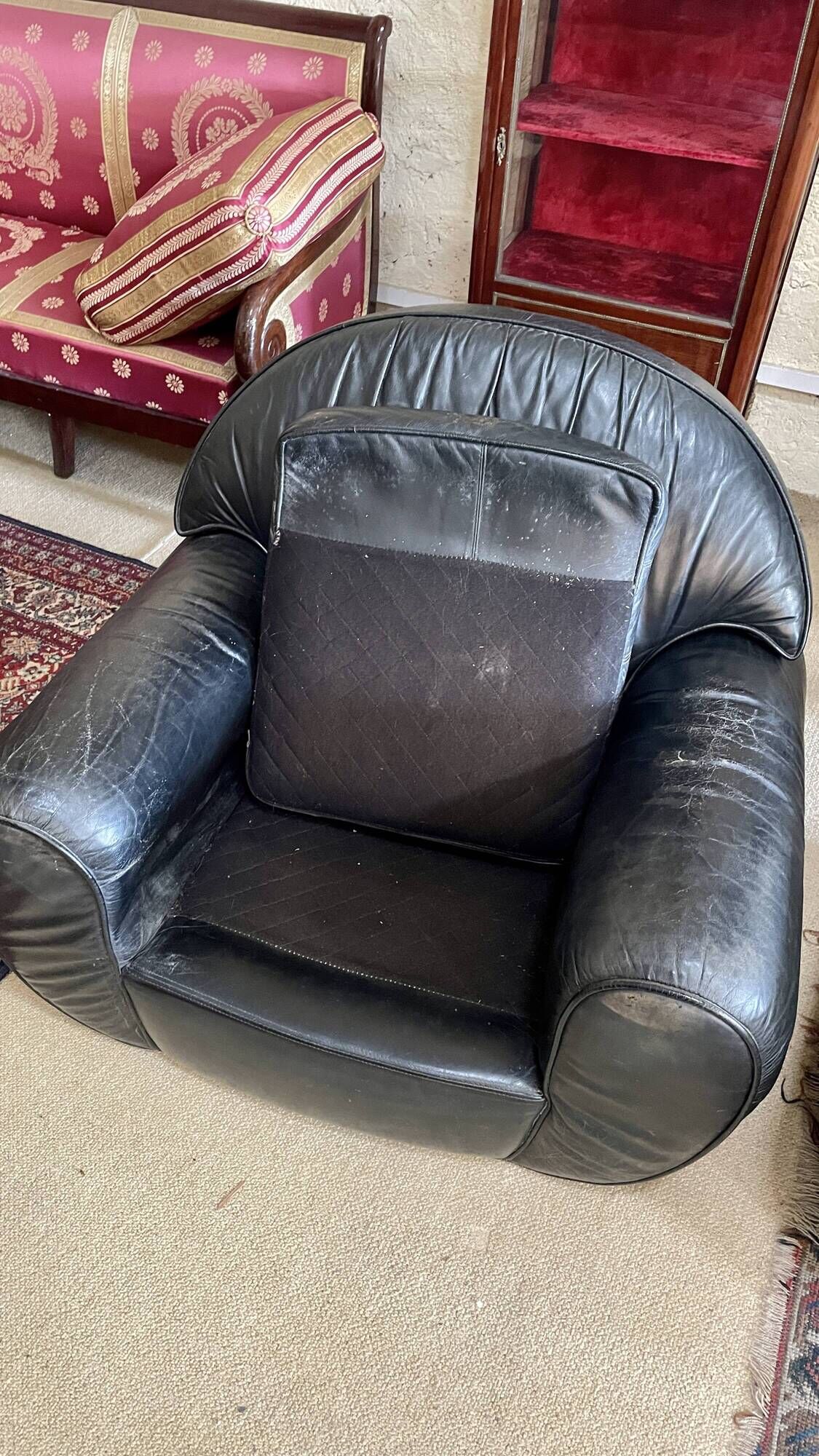 Pair of black leather club armchairs, twentieth century