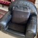 Pair of black leather club armchairs, twentieth century