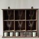 Antique commercial shelving unit with compartments