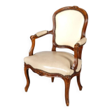 Louis XV period armchair in natural wood with convertible back carved with flowers