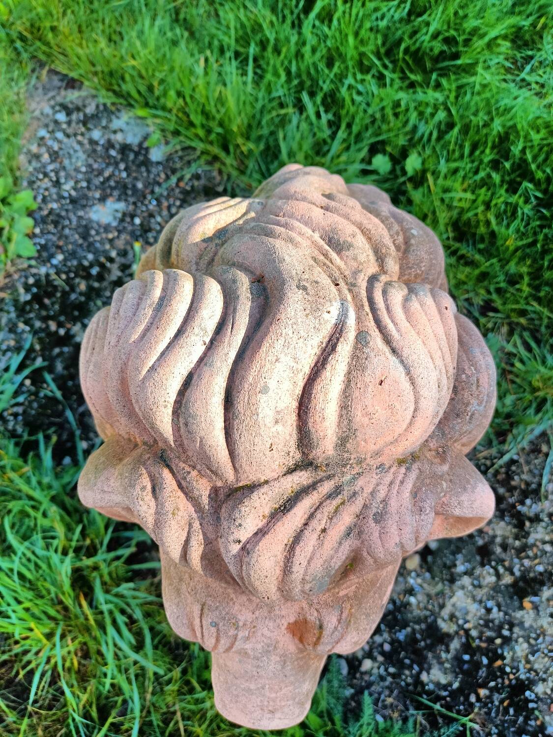 Pair of old terracotta garden lions