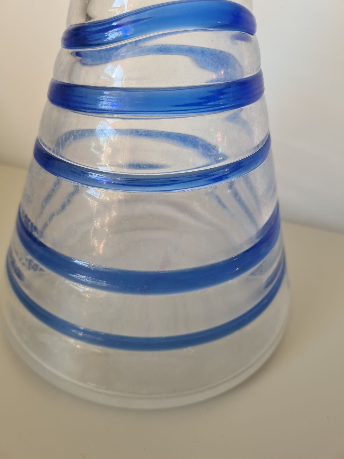 Conical glass vase/carafe blown with a blue spiral decoration.