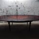 Oval Louis XVI style table with half-moon extensions.
