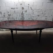 Oval Louis XVI style table with semi-circular extensions.