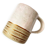 Handmade golden ceramic mug