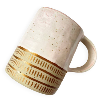 Handmade golden ceramic mug