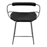 Contemporary sculptural bar stool c. Black smoked metal backrest and black leather.