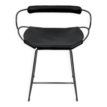 Contemporary sculptural bar stool with a smoked black metal backrest and black leather.