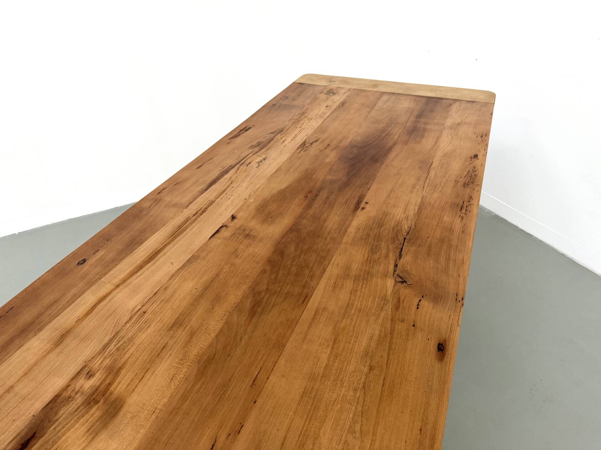 Farm table in solid cherry — Saber legs, Circa 1880