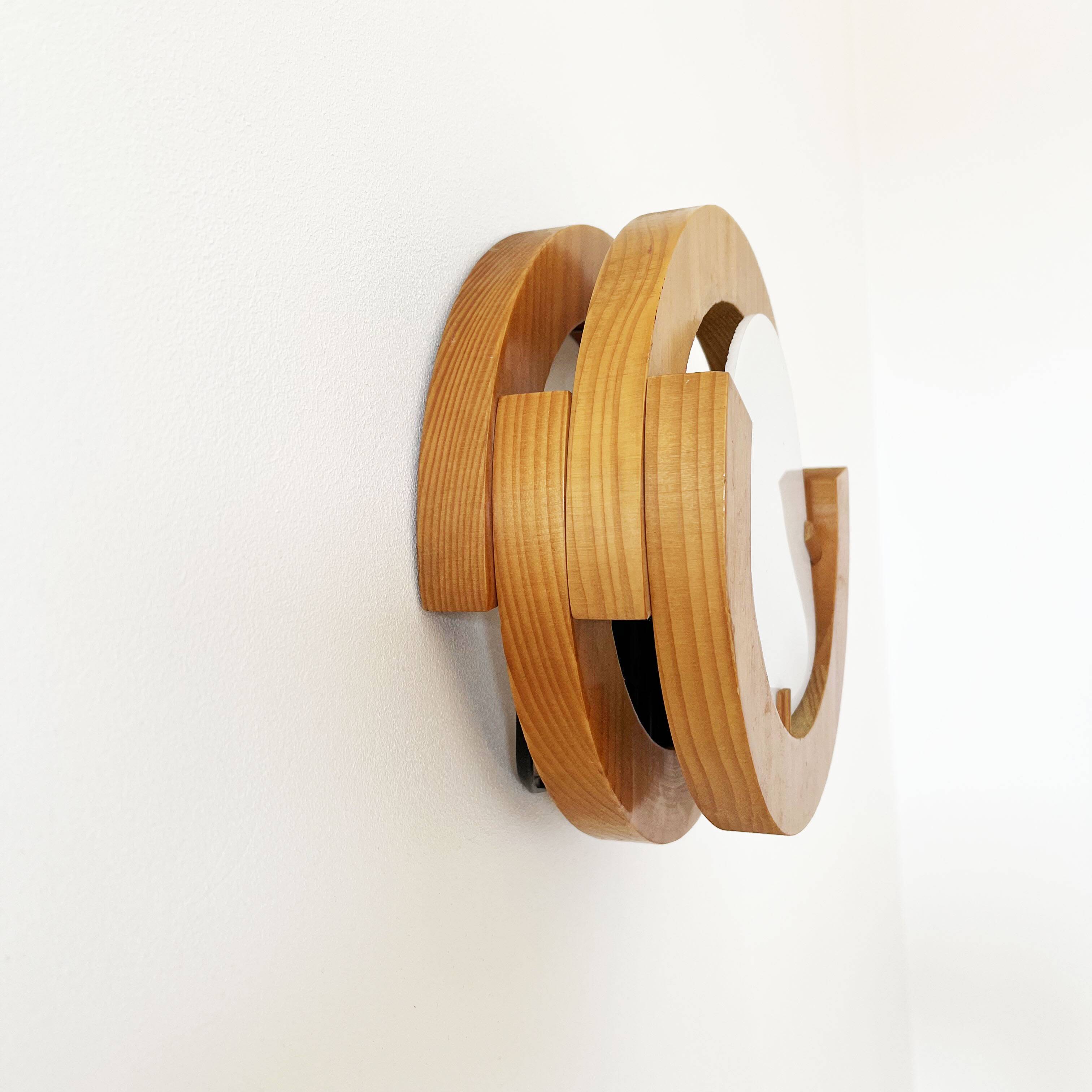 Round pine and plexiglass wall light, 1970s