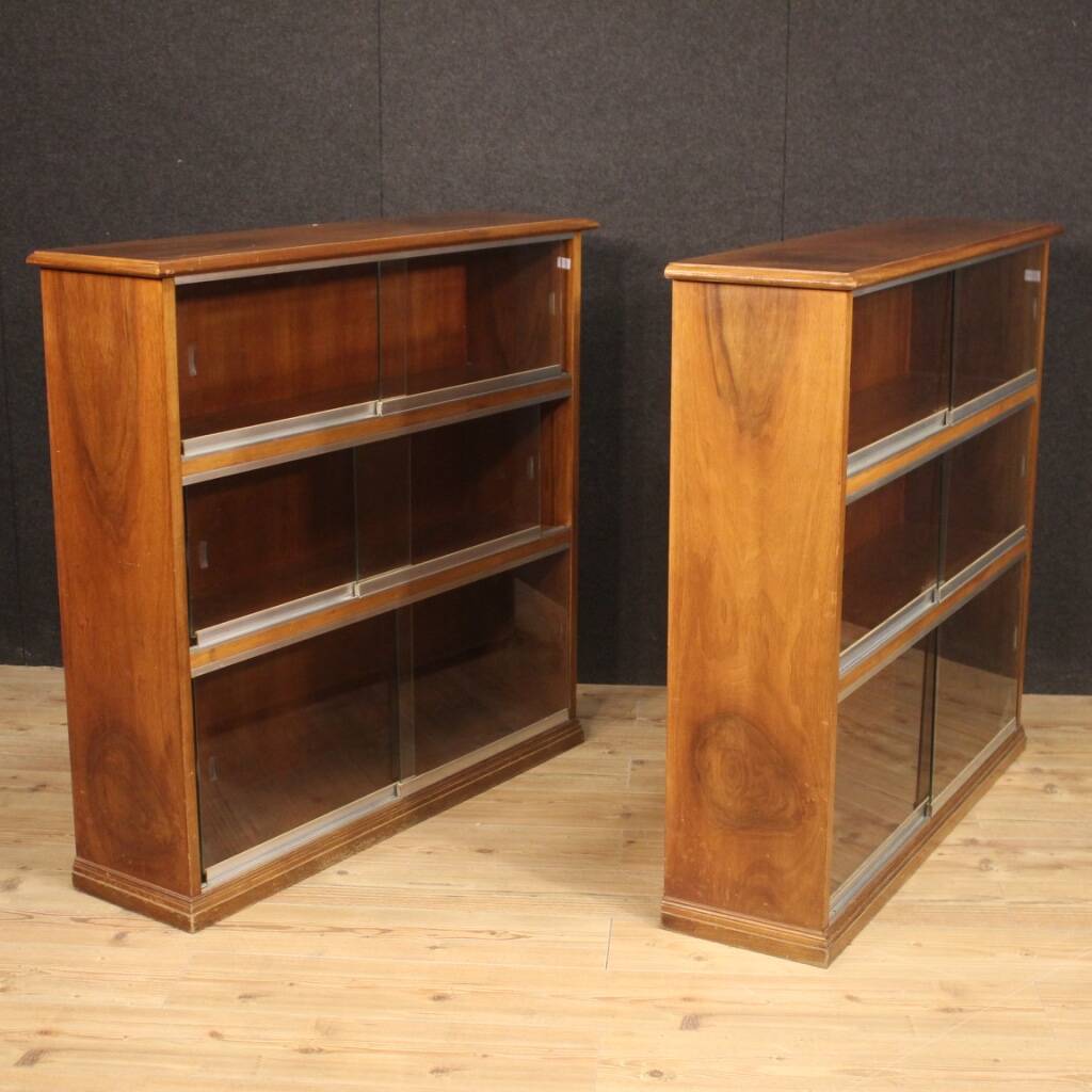 Pair of Italian bookcases in walnut wood with glass doors