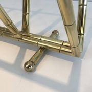 Brass faux-bamboo style magazine rack