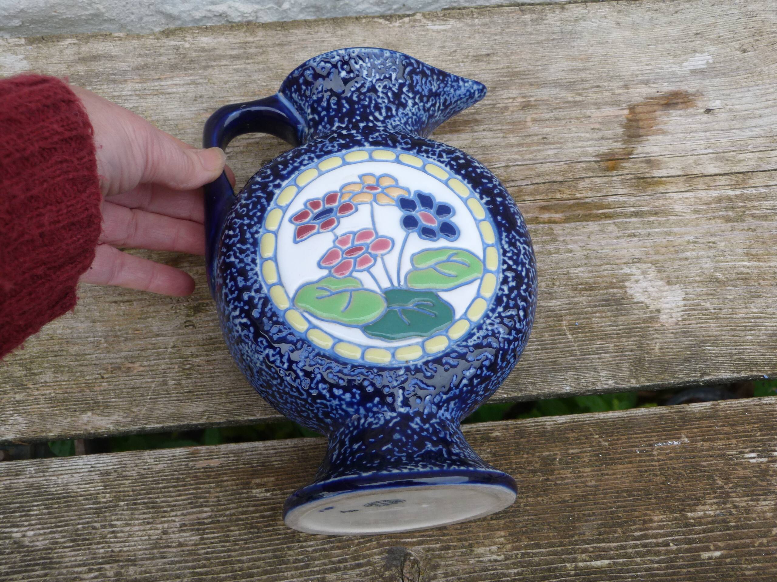 Blue ceramic vase with floral motifs