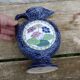 Blue ceramic vase with floral motifs