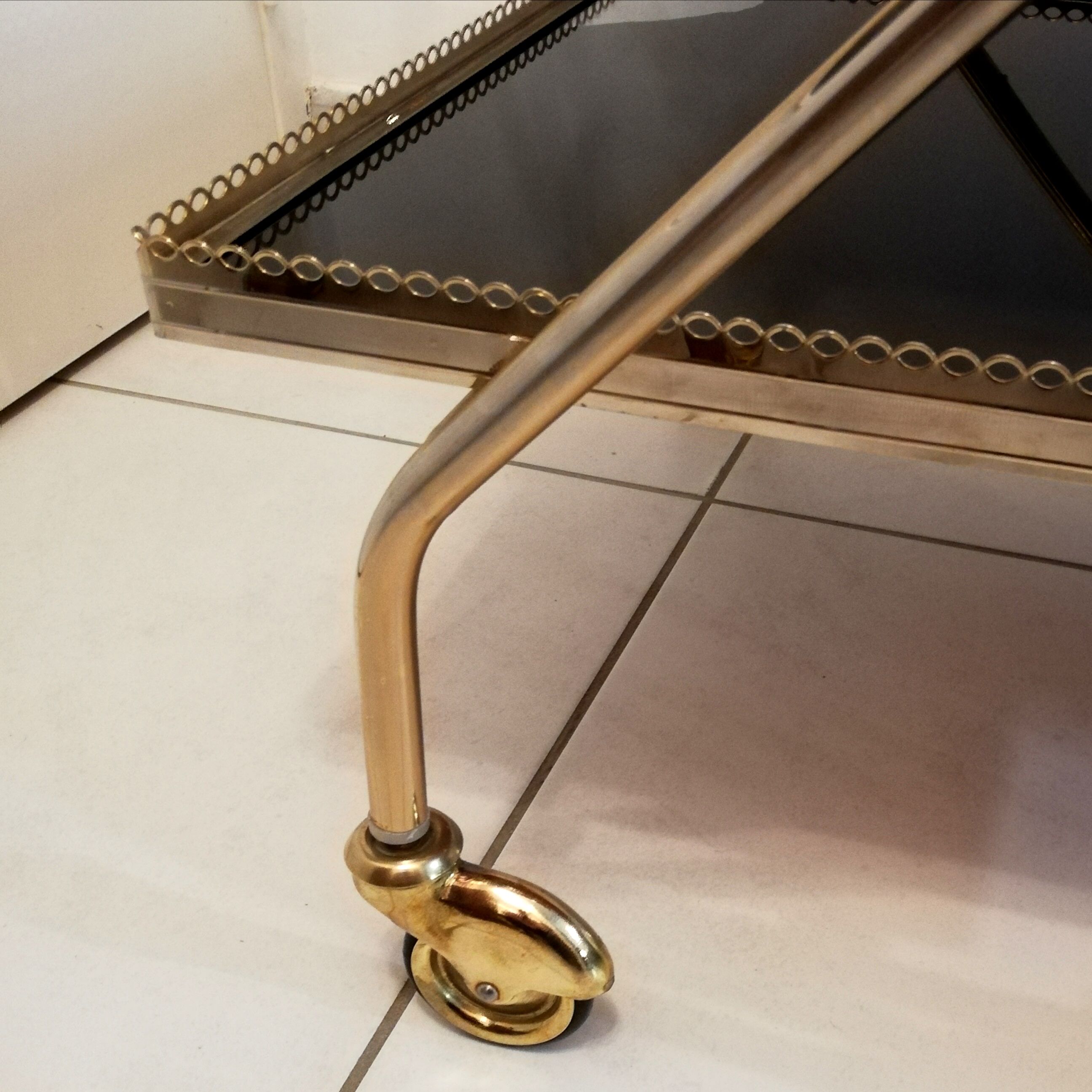 Golden brass trolley wheeled dessert and glass trays