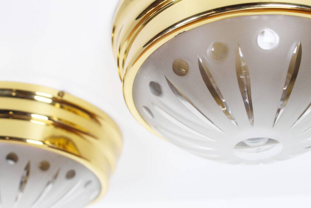 Pair of vintage brass ceiling lights with glass globe