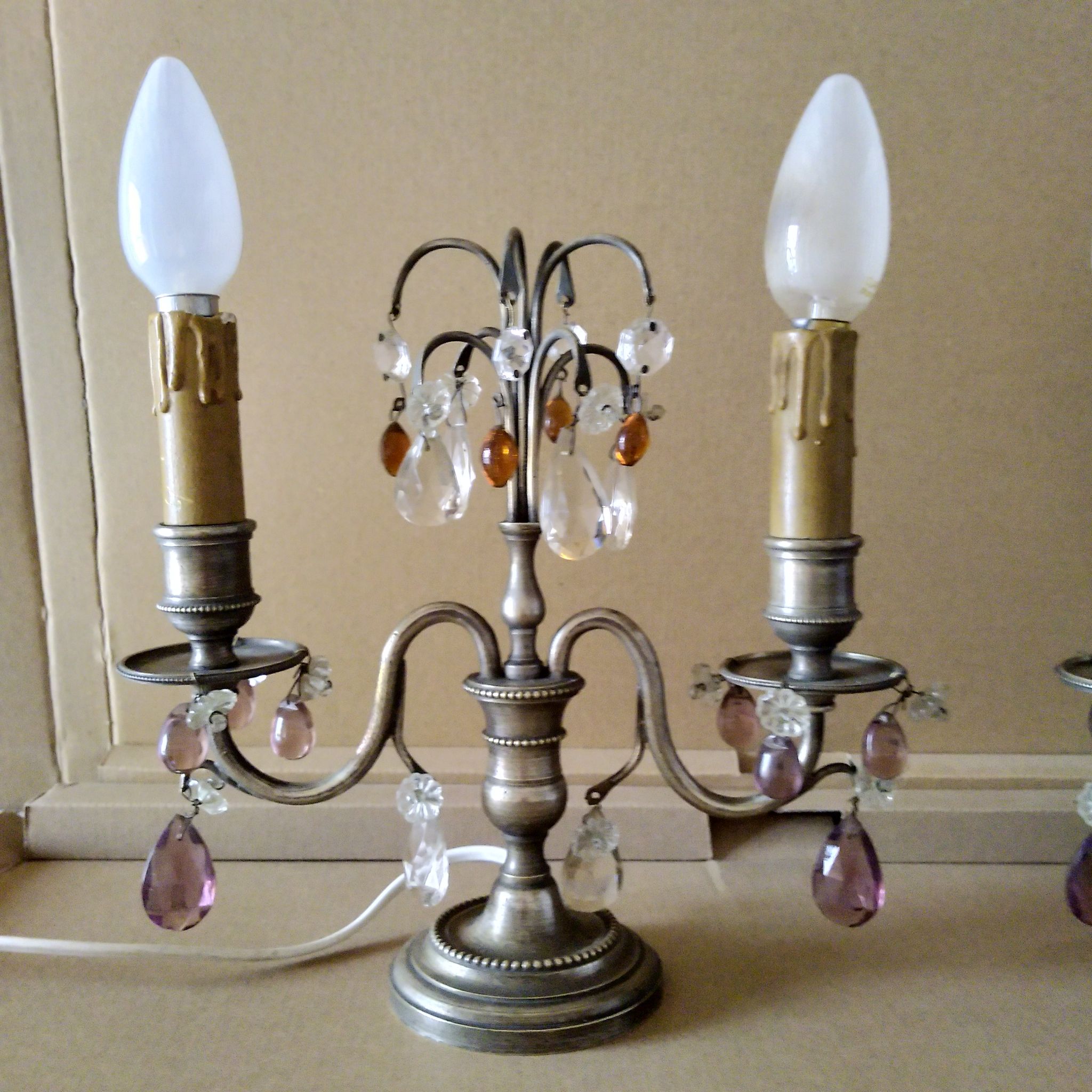 Pair of girandole lamps and silver metal