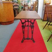 Bistro table over wood cast iron legs