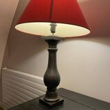 Lamp with red hat and cast iron base