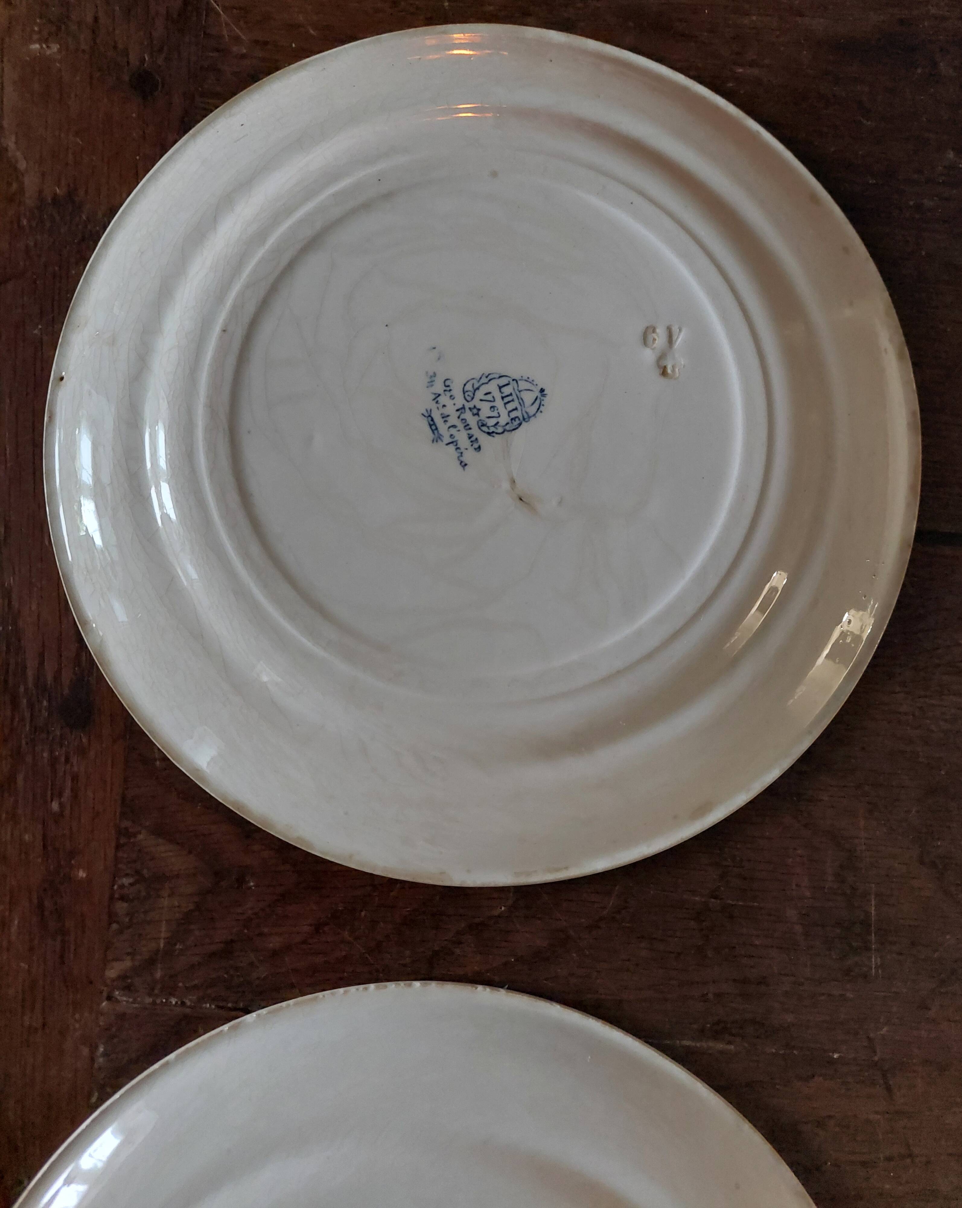Set of eight flat plates, ironstone, Géon Rouard, Lille decoration, years.