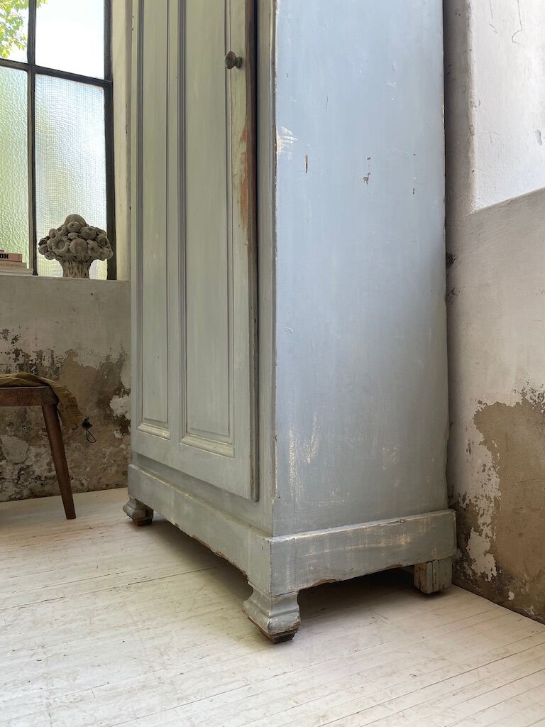 Blue patinated cap cabinet