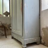 Blue patinated cap cabinet