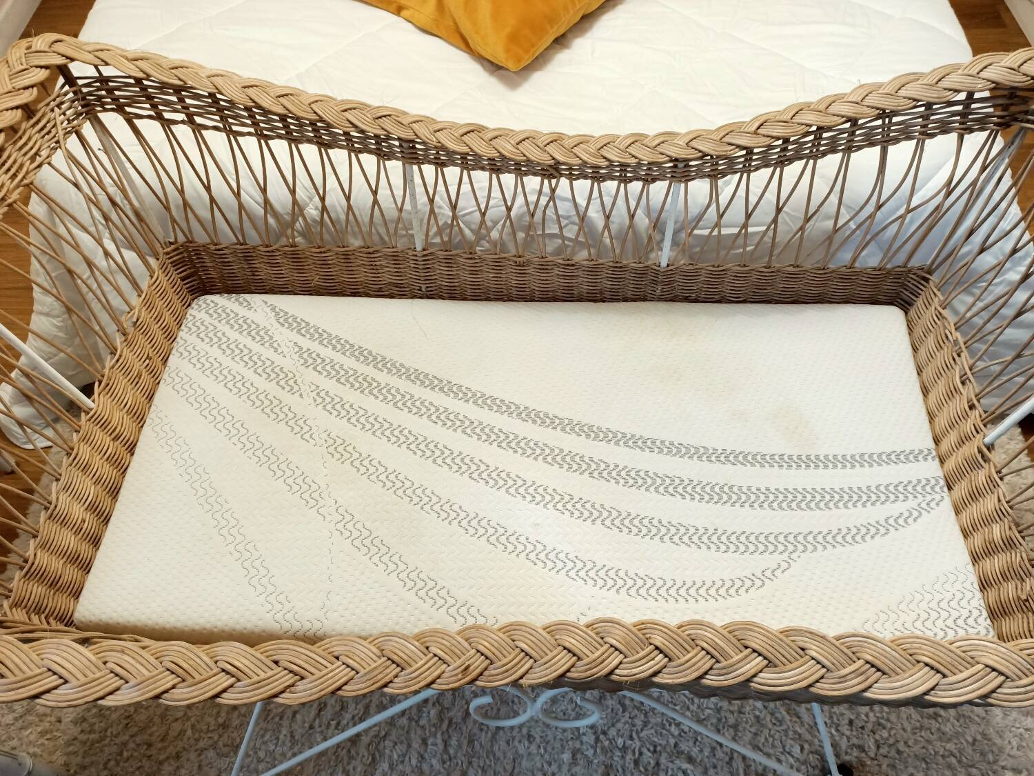 Rattan and wrought iron cradle