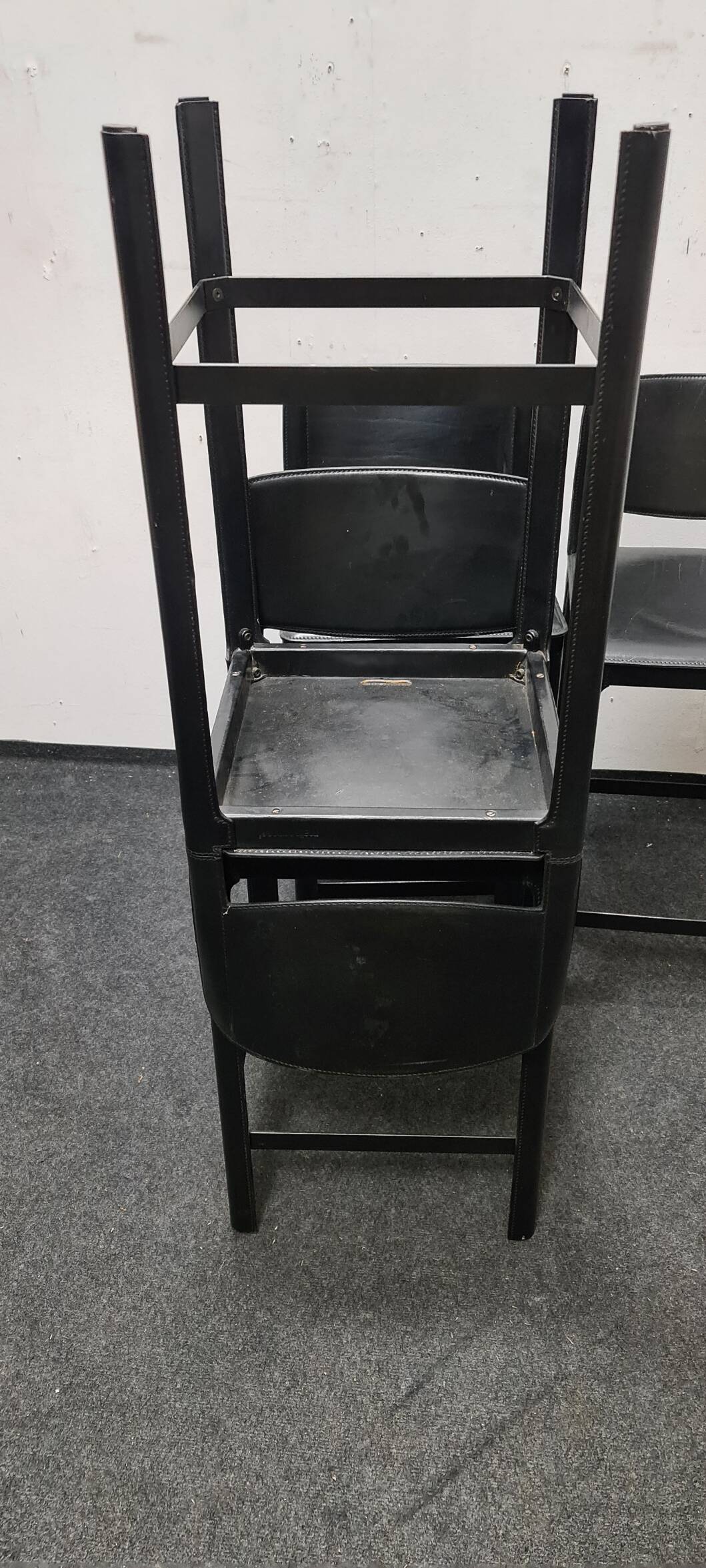 A set of four Italian leather bar stools by Matteo Grassi