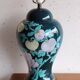 Vintage ceramic lamp with floral decoration.